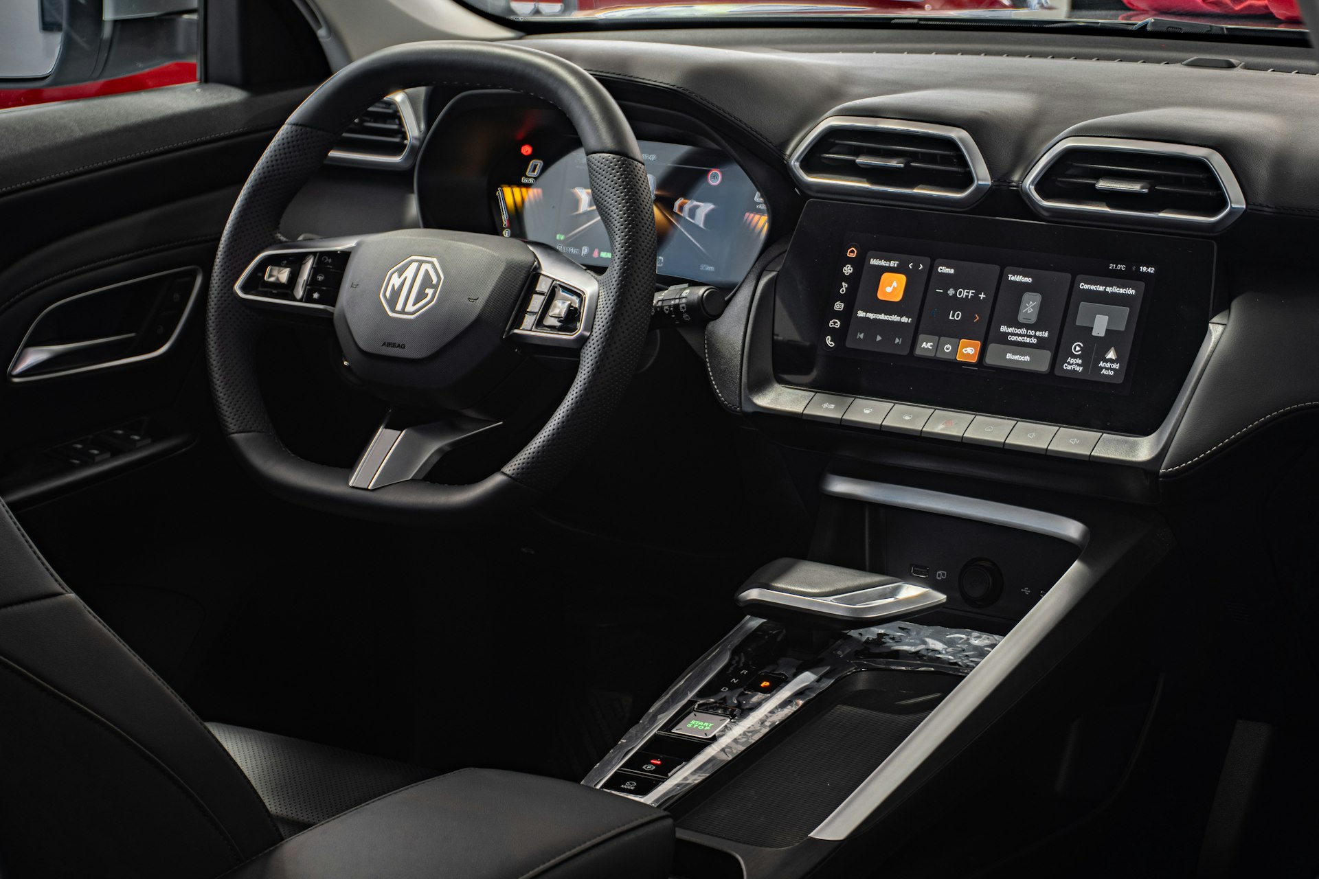 Modern car interior with digital dashboard and touchscreen.